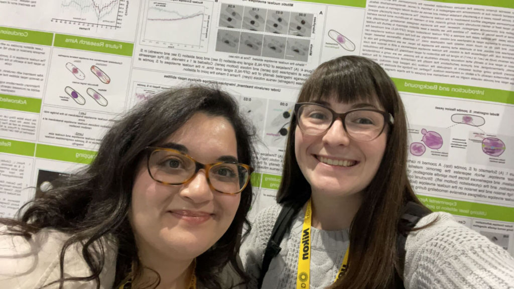 Postdoc Reem Hakeem and Taylor Couture in front of Reem’s poster